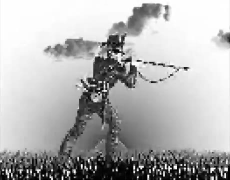 A corrupted black-and-white image of a figure aiming a rifle